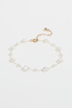 Classic Pearl Bracelet With Extender, Feminine Pearl Drop Bracelets, Feminine Pearl Beaded Bracelets, Feminine Pearl Bracelets With Pearl Charm, Elegant Adjustable Chain Bracelet With Pearl Charm, Elegant Adjustable Pearl Charm Chain Bracelet, Adjustable Pearl White Bracelets With Pearl Chain, Adjustable Pearl White Bracelet With Pearl Chain, Adjustable Pearl White Bracelet With Pearl Drop