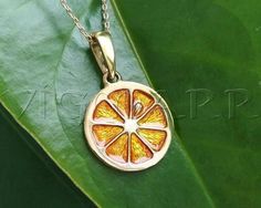 Brass Lemon PendantMaterial: • Brass, Acrylic enamel.Color:•Green •Yellow •Orange •RedSize: 0.79 in. or 20 mm.The chain is not included•Lemons are a hybrid between a sour orange and a citron.•Lemons are rich in vitamin C.•Lemons trees can produce up to 600lbs or 270kg of lemons every year.•Lemon trees produce fruit all year round.•Lemon zest, grated rinds, is often used in baking.•Lemon tree leaves can be used to make tea.•The high acidity of lemons make them good cleaning aids.•The most common Unique Orange Jewelry For Anniversary, Yellow Round Pendant Jewelry Gift, Yellow Pendant Charm Necklace For Gift, Yellow Locket Jewelry For Gift, Yellow Locket Jewelry As Gift, Orange Round Necklace For Gifts, Orange Charm Jewelry For Gifts, Orange Pendant Charm Necklaces For Gifts, Yellow Round Pendant Jewelry For Wedding