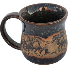 a brown and black mug with horses on it