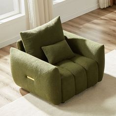 a green chair sitting on top of a hard wood floor next to a white rug