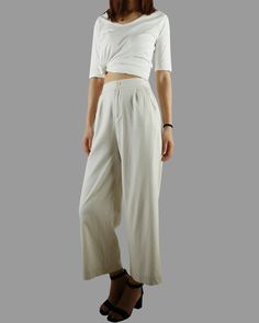 * A wide leg cropped linen pants, with cropped length, two pockets, fixed waist on front and elastic waist on back. * Material: 50% linen, 50% cotton Custom made to fit, lead time is 6-8 days; Let us know your usual size in your country and your overall height. If you have some specific request or special characters such as broad shoulder, long arms, long waist, etc you think we need pay attention to when making, do let me know. * Colors: 1. Beige 2. White 3. Black 4. Khaki 5. Coffee * Shop sizi Versatile Baggy Wide Leg Pants For Spring, Versatile Solid Culottes For Spring, Cotton Straight Culottes For Spring, Versatile Wide-leg Harem Pants For Spring, Wide Leg Harem Pants For Spring Loungewear, Spring Linen Wide Leg Pants, High-waisted Relaxed Fit Cotton Culottes, Chic Linen Culottes For Spring, Spring Relaxed Fit Ankle-length Culottes