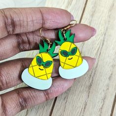 This pineapple is enjoying its pool time in its floaty. Lightweight earrings made with shiny yellow and green acrylics with hand-painted details and a pastel inner tube. These come with a fishhook backing. You may alternatively select ball post studs, huggie/leverbacks, or clip-ons. Metal is gold-toned, if you would like silver-toned metal, add it to the special instructions in your cart! Dimensions: Dangle Earrings: 1.5 in (38 mm) L x 1.25 in (32 mm) W The drop length is about 2.0 in (51 mm). M Green Acrylics, Summer Pineapple, Silicone Molds Jewelry, Earring Organizer, Reflective Material, Pool Time, Inner Tube, Microfiber Cleaning Cloths, Inner Tubes