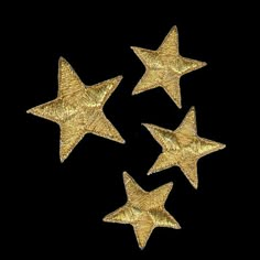 five gold stars on a black background