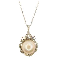 Introducing our Vintage Baroque Style 14mm Mabé Pearl Necklace Pendant in Sterling Silver, a stunning piece that showcases the timeless elegance of a lustrous Mabé Pearl in a unique and intricate design. At the center of this pendant rests a stunning creamy white Mabé Pearl, boasting a smooth and lustrous surface. With its shimmering iridescence and creamy white appearance, this pearl exudes timeless charm and sophistication. Each pearl is carefully selected for its exceptional quality, ensuring Mabe Pearl Necklace, Baroque Necklace, Pearl Necklace Pendant, Diamond Pendants Designs, Simply Dress, Pearl Necklace Vintage, Diamond Pendants, Style Baroque, Mabe Pearl