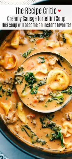 a ladle full of creamy sausage tortellini soup