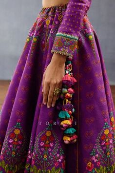 Purple lehenga featuring mughal floral and rose prints with a rounded hem. Paired with a sequin and thread embroidered blouse and a scallop bordered dupatta., Fit: Relaxed Silk Crafts Ideas, Hangings For Lehenga Tassels, Latkan For Lehenga, Tassels Fashion Clothing, Indian Dress Up, Cancan Lehenga, Designer Tassels, Print Motifs, Saree Tassels Designs