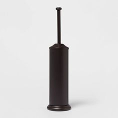 a black toilet brush holder on a white background