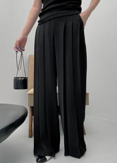 Color: Black Lightweight fluid fabric Relaxed fit Mid rise Wide leg Front pleats Slant hip pockets Illusion welt back pockets Front button closure Zip fly Partially lined 100% Polyester Dry Clean By The Frankie Shop. Imported Luxury Pants With Concealed Placket In Suiting Fabric, Luxury Formal Pants With Pleated Waist, Luxury Pleated A-line Bottoms, Black Accordion Pants, White Wide Leg Trousers, Patchwork Fashion, Denim Suit, Y2k Pants, Classic Trousers