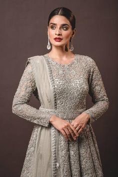 Grey trail anarkali highlighted with intricate dori embroidery, embellishments, round neckline and full sleeves. Comes with tulle dupatta. Gown With Belt And Dupatta, Gown With Trail, Gown Belt, Dori Embroidery, Grey Gown, Gown With Dupatta, Tulle Embroidery, Designing Clothes, Tone Skin