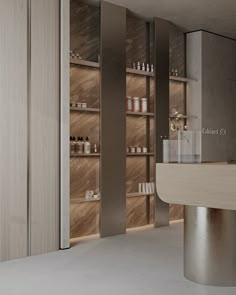 an empty counter in a store with lots of bottles on the shelves next to it