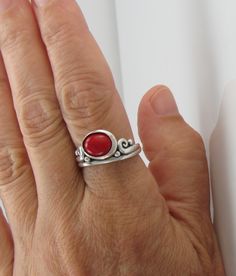 R1330- Sterling Silver Ring with a 8 x 10 mm Red Coral Cabochon, Size 9. **THE STONE IN THIS RING IS NOT YET SET** so it is easier for me to size without damaging the stone. I can size it to fit, just contact me. No charge to size down. The top of the ring measures 12mm and the band is 2 mm. This ring is made by the Lost wax Casting method, were I make the design in wax and then cast it into silver. To learn more about Me and the Lost Wax Method please visit my website at www.denimanddiamondsjew Unique Red Cabochon Jewelry, Adjustable Red Cabochon Jewelry, Unique Round Cabochon Ruby Ring, Handmade Red Oval Cabochon Jewelry, Artisan Red Jewelry For Anniversary, Hand Forged Red Jewelry For Gifts, Hand Forged Red Jewelry As A Gift, Red Sterling Silver Oval Cabochon Jewelry, Handmade Oval Cabochon Ruby Ring For Anniversary