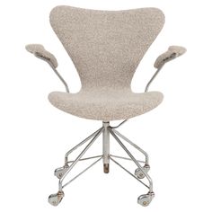 an office chair with wheels on the back and seat upholstered to it's base