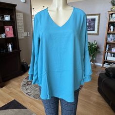 Zenana Blue 3/4 Large Double Ruffle Sleeves Vneck Blouse. Beautiful. Brand New With Tag Still Attached. Size M. Armpit To Armpit Is 20 Inches, Length Is 27 Inches. Says It’s A Size L, But Measurements Say It’s A Size M. Material Is 100% Polyester. Blue V-neck Blouse For Fall, Blue V-neck Blouse For Brunch, Blue Flowy V-neck Top, Blue Bell Sleeve Top For Fall, Elegant Blue Blouse With 3/4 Sleeves, Chic Blue Tops With 3/4 Sleeve, Flowy Tunic Tops, Batwing Sleeve Blouse, Green Tunic