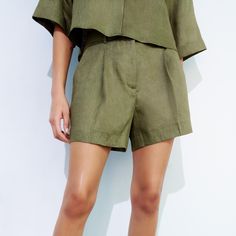 Zara High Rise Linen Blend Shorts In Khaki.....Size S. Viscose/Linen. Olive Green. Zipper Fly With Hook/Bar And Interior Button Closure. High Waisted. Belt Loops. Slanted Front Pockets. Faux Back Flap Pocket. Pleated Front. Waist Across 13.75". Front Rise 13". Hip Across 20.75". Inseam 4". Length About 15.75". New With Tag. 3 Chic Linen Bottoms With Short Inseam, Elegant Wide Leg Relaxed Fit Shorts, Chic Olive High Waist Bottoms, Zara Linen Workwear Bottoms, Chic Short Leg Relaxed Fit Pants, Chic Relaxed Fit Short Leg Pants, Chic Relaxed Fit Short Pants, Chic Relaxed Fit Bottoms With Short Inseam, Chic Relaxed Fit Shorts With Short Inseam