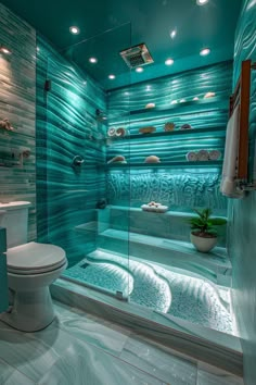 a bathroom with blue and white tiles on the walls