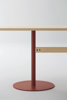 a wooden table with two red bases