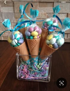 some ice cream cones filled with candy and candies