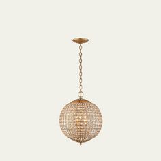 a gold chandelier hanging from a ceiling fixture with crystal balls on the chain