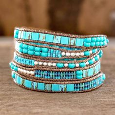 The contrast between blue and turquoise with silvery colored beads inspires soothing elegance. Women artisans from Guatemala's Weaving Hands of Atitlan craft the wrap bracelet by hand with dark brown cords. Wrap Armband, Bracelets Diy, Wristband Bracelet, Beaded Wrap Bracelets, Bracelet Blue, Homemade Jewelry, Beaded Wraps, A Bracelet, Beaded Bracelets Diy