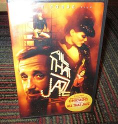 the dvd cover for chicago all that jazz is sitting on top of a carpeted floor