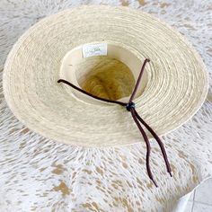 Hand woven fine palm hat. Brim measures 4”. Available in S/M or L/XL. 100% natural palm fiber is grown in warm coastal areas of Mexico and as a sustainable fiber is environmentally friendly. SPF 50 rating by California Polytechnic State University. Material: Hand woven palm sewn with double lock stickers. variations in color our weave are natural. Each hat is unique. Packing: Palm is very pliable and can be packed in a suitcase with articles of clothing stuffed in and around the crown. Re-Shapin Handwoven Natural Color Sun Hat For Rodeo, Handwoven Natural Sun Hat For Rodeo, Lightweight Straw Hat In Natural Color, Adjustable Coastal Straw Hat Made Of Toquilla, Handwoven Natural Straw Hat For Rodeo, Natural Handwoven Straw Hat For Rodeo, Natural Woven Sun Hat For Rodeo, Eco-friendly Short Brim Straw Hat For Beach, Handwoven Natural Hat Band With Flat Brim