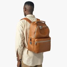 Our flagship leather backpack is thoughtfully designed and built to last. This casual and refined piece in natural grain leather includes adjustable padded shoulder straps, a deluxe top carry handle, and matte-nickel hardware. The premium tan leather is soft to the touch with a natural grain variation that will patina beautifully, adding to its character over time. Head into the office, gym, and weekend without missing a beat—and count on the Runwell Backpack to be in it for the long run. | Shin Modern Brown Backpack For Everyday Carry, Classic Leather Backpack With Smooth Grain For Everyday Use, Everyday Leather Backpack With Smooth Grain, Modern Brown Leather Backpack For Everyday Carry, Modern Brown Leather Backpack For Everyday, Modern Brown Leather Backpack, Modern Brown Leather Backpack For Commuting, Luxury Soft Leather Everyday Backpack, Classic Backpack With Smooth Grain For Everyday Use