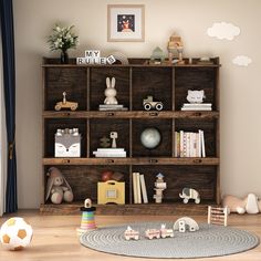 a child's room with toys and bookshelves on the floor, including a rug