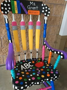 a child's rocking chair made out of crayons