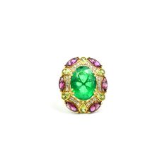 Inspired by traditional Victorian floral patterns, this ring features a magnificent oval diamond-cut emerald gemstone as its centerpiece. The emerald rests upon a grapevine-like structure adorned with radiant pear-shaped peridot and deep red marquise-shaped Rhodolite garnet. The intricate design is set on a yellow gold-plated Sterling Silver band, exuding timeless elegance and vintage charm. Technical Specifications -Gemstones: Emerald (Natural Coated), Peridot, Rhodolite, White Zircon -Metal: S Oval Multi-stone Emerald Gemstones, Luxury Green Oval Gemstones, Exquisite Oval Green Emerald Ring, Exquisite Green Oval Emerald Ring, Formal Oval Emerald Ring With Gemstone Accents, Oval Emerald Gemstones With Accents, Oval Emerald Gemstone With Center Stone, Oval Tsavorite Ring With Center Stone, Oval Multi-stone Emerald Ring Fine Jewelry