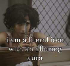 a woman sitting in front of a laptop computer with the caption i am a litter icon with an alluring aura