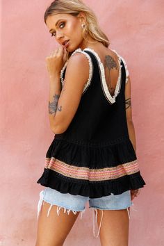 Black top.Surplice neckline.Fringe trim inserts.Crochet trim details.V-back.Loose fit.Fluted hem.  You'll want to pack your bags and head straight for the beach cause this top gives you all the vacay vibes. With its breezy, loose fit, fringe trim and crochet inserts, you won't want to take it off. Our Bali top looks amazing teamed with cut-off shorts and wedges, it's a Summery look we can't get enough of.   MODEL INFO  Model is wearing size XS Height: 5’6” Bust: 33” Waist: 25” Hips: 37 Black Top With Frayed Hem For Summer, Black Tops With Frayed Hem For Summer, Chic Beach Tops With Frayed Hem, Beach Tops With Frayed Hem, Bohemian Beach Tops With Frayed Hem, Black Bohemian Top With Crochet Trim, Summer Beach Top With Frayed Hem, Vacay Vibes, Yellow Bridesmaids