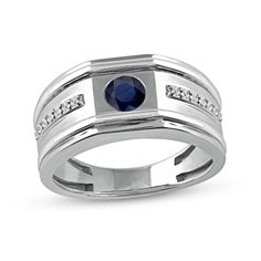 Express your stylish self with the modern flat-top and grooved details of this men's blue sapphire and diamond side accent band in white gold. Created in cool 10K white gold This look showcases a grooved center adorned with a faceted 5.0mm bright blue sapphire set along the flat top. Two sleek rows of diamonds line the center of the shank. The raised borders and the stepped edges lend further depth and contrast to the design. 1/8 ct. t.w. of diamonds Blue sapphire is the traditional birthstone f Modern Sapphire Ring With Diamond Accents, Modern White Gold Sapphire Ring With Diamond Cut, Modern Sapphire Ring With Diamond Accents For Anniversary, Raised Borders, Peoples Jewellers, Modern Flat, September Birthstone, Sapphire Engagement, Flats Top