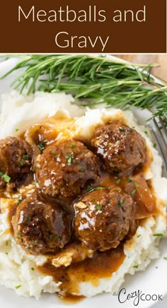 meatballs and gravy on top of mashed potatoes with green garnish