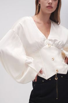 PRODUCT DETAILS Women’s blouse Deep V-neckline Corseted waist panels Full, gathered blouson sleeves Non-functional buttons Angled hemline Shop All Tops SIZE AND FIT Model wears a size 8/S Model: 176cm/5’9.5" Bust: 80cm Waist: 58cm Hips: 88cm FABRICATION 81.5% Acetate 18.5% Polyester Lining: 100% Cotton Delicate Cold Hand Wash Seperately Engagement Party Dresses, White Corset Top, Victorian Blouse, Straykids Hyunjin Photoshoot, Fashion Design Portfolio, Modern Victorian, White Corset, Fashion Mistakes, Blouse Online