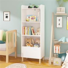 a child's room with blue walls and white bookcases filled with books