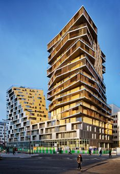 a tall building with lots of balconies on top of it's sides