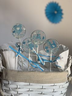 blue and white cake pops in a basket