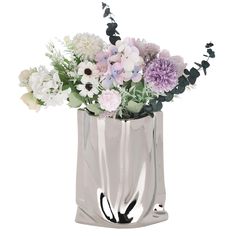 a vase filled with lots of different colored flowers