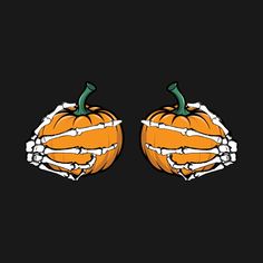 two orange pumpkins with skeleton hands on each one's sides, against a black background