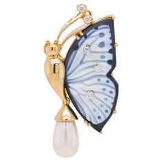 This exquisite pendant brooch is truly one of a kind. Crafted with meticulous attention to detail, it showcases a breathtaking combination of materials and artistry. The focal point of this piece is a hand-carved agate butterfly wing, delicately set in a stunning 18 Karat yellow gold frame. The agate wing, carefully selected for its natural beauty, has been skilfully dyed to create a striking contrast between black and white hues. The carving work has been masterfully executed on the white porti Exquisite Collectible Jewelry Brooch, Exquisite Collectible Brooch Jewelry, Luxury White Hallmarked Brooch, Luxury Hallmarked White Brooches, Luxury Diamond Pendant Brooches, Luxury White Gold Brooches Collectible, Luxury White Gold Collectible Brooch, Luxury White Gold Collectible Brooches, Exquisite Pendant Brooch For Formal Occasions