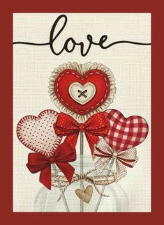 a red and white card with hearts on it's front, says love in the middle