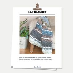 the lap blanket is on display next to a potted plant