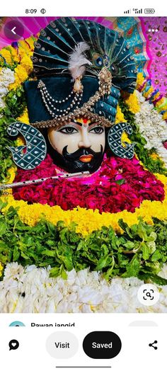 an image of a person wearing a mask and surrounded by flowers