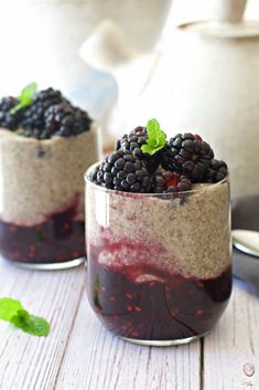 two desserts with berries and blackberries in them