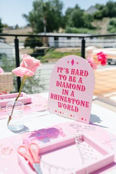 there is a sign that says it's hard to be a diamond in a rinestone world