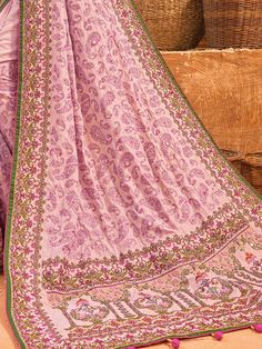 Adorn yourself in the exquisite charm of this pink banarasi silk saree, a testament to timeless beauty and sophistication. The lustrous silk material drapes gracefully, creating an enchanting canvas for the meticulous kachhi work, delicate diamond embellishments, and mesmerizing mirror work.
The ensemble is completed with a matching silk blouse, mirroring the saree's elegance with kachhi work, diamond detailing, and mirror work. The unstitched blouse material allows for customization, ensuring a Pink Pre-draped Saree With Motifs, Pink Anarkali Style Silk Pre-draped Saree, Pink Raw Silk Pre-draped Saree For Puja, Traditional Pink Pre-draped Saree For Diwali, Festive Pink Silk Pre-draped Saree, Pink Silk Pre-draped Saree In Traditional Style, Traditional Pink Silk Pre-draped Saree, Traditional Pink Saree With Resham Embroidery, Traditional Pink Blouse Piece With Zari Work