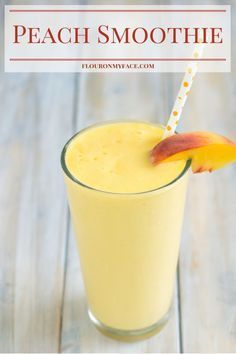 a peach smoothie in a glass with a straw