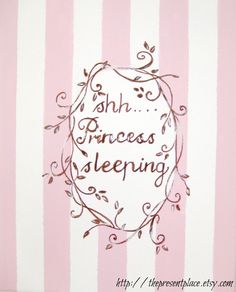 a pink and white striped wall with the words shh princess sleeping on it