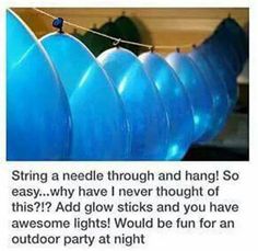 an image of some blue balloons hanging from a line