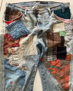 an old pair of jeans with patchwork on the back and sides, all in different colors